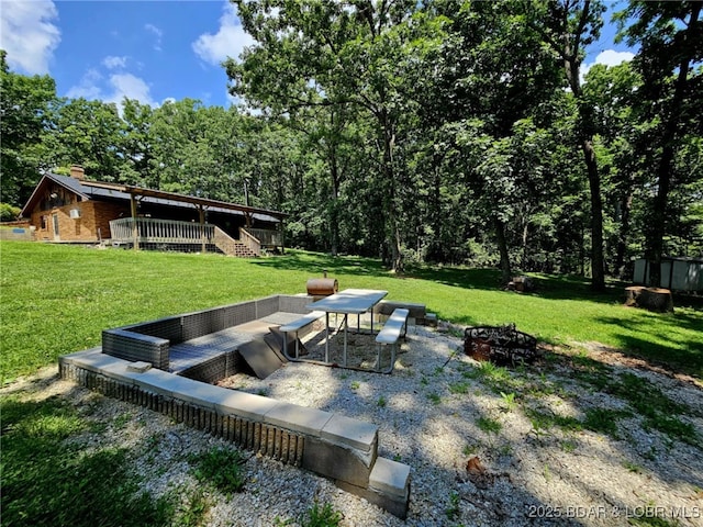 238 Foote Lane Rd, Eldon, MO 65026 - view of green lawn with an outdoor fire pit, a deck, and stairway