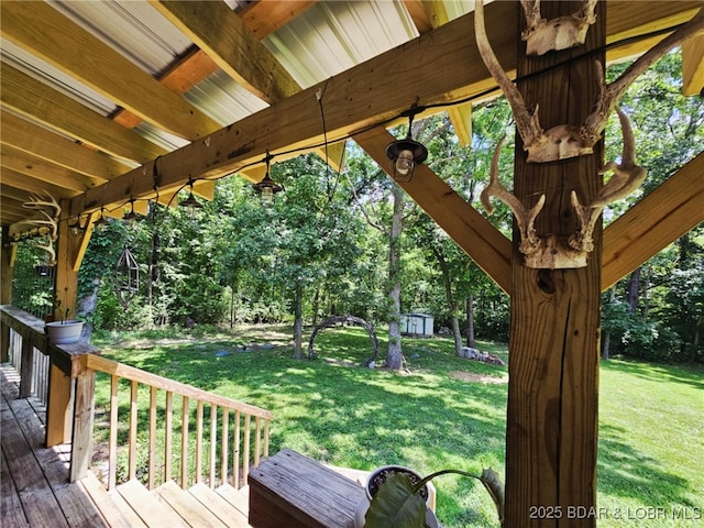 238 Foote Lane Rd, Eldon, MO 65026 - wooden deck featuring a lawn, view of wooded area, and a shed