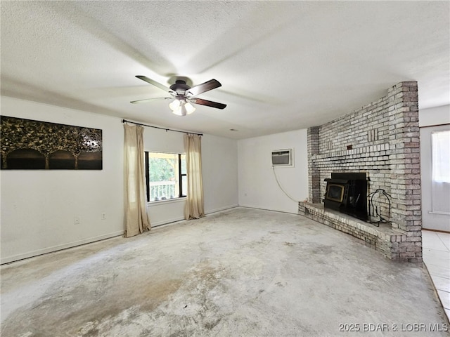 238 Foote Lane Rd, Eldon, MO 65026 - unfurnished living room featuring a ceiling fan, unfinished concrete flooring, a wall mounted air conditioner, and a textured ceiling