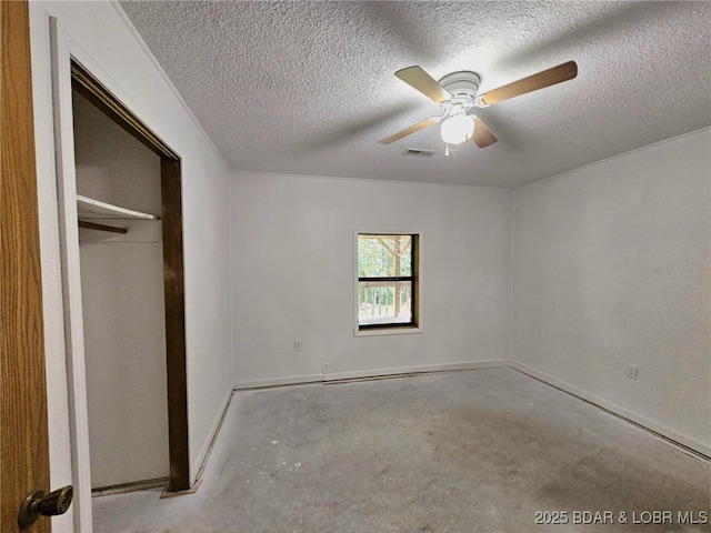 238 Foote Lane Rd, Eldon, MO 65026 - unfurnished bedroom featuring concrete flooring, a textured ceiling, ceiling fan, and a closet