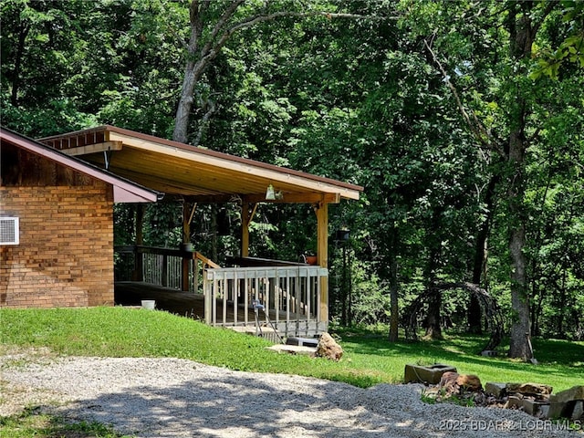 238 Foote Lane Rd, Eldon, MO 65026 - view of grassy yard featuring a wooden deck and a wooded view