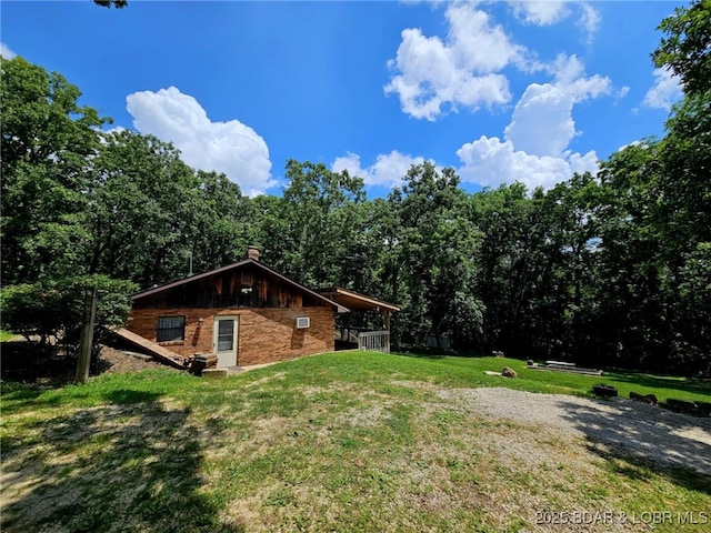 238 Foote Lane Rd, Eldon, MO 65026 - view of property exterior with a yard, a chimney, and a view of trees