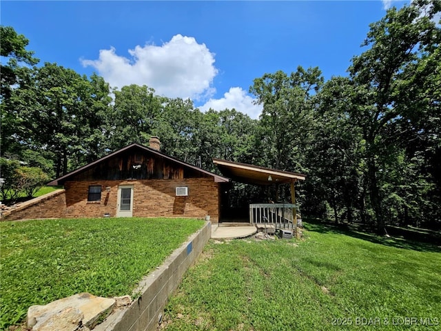 238 Foote Lane Rd, Eldon, MO 65026 - view of property exterior featuring a yard, a chimney, and brick siding
