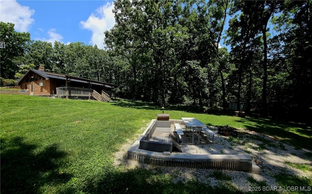 238 Foote Lane Rd, Eldon, MO 65026 - view of green lawn with a deck, stairs, and a view of trees