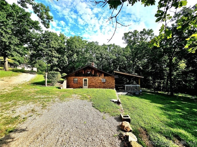 238 Foote Lane Rd, Eldon, MO 65026 - view of home's exterior featuring a chimney, a yard, and gravel driveway