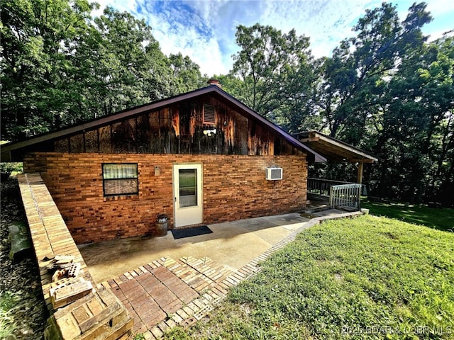 238 Foote Lane Rd, Eldon, MO 65026 - view of front of house with a front lawn, brick siding, and a patio area