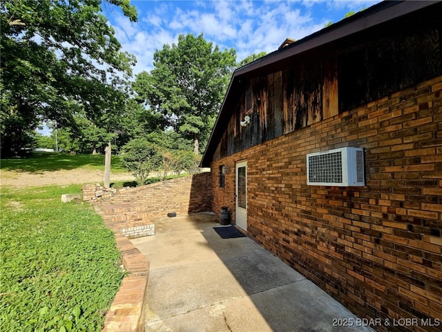 238 Foote Lane Rd, Eldon, MO 65026 - view of home's exterior featuring a patio area, brick siding, and a lawn