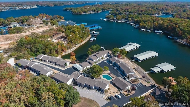 28 Eleven W Ct Unit 2A, Sunrise Beach, MO 65079 - aerial overview of property's location with a large body of water and a heavily wooded area