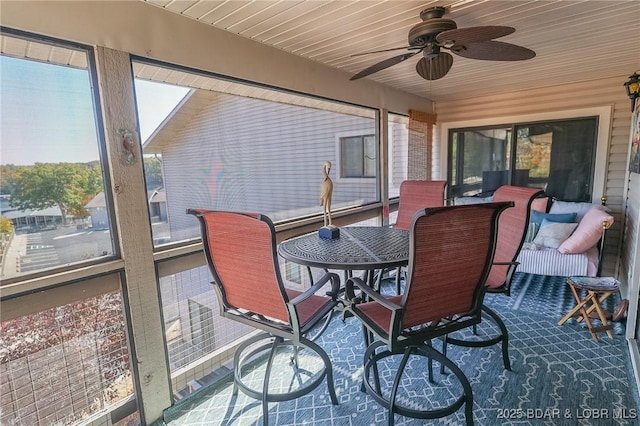 28 Eleven W Ct Unit 2A, Sunrise Beach, MO 65079 - sunroom / solarium featuring ceiling fan and outdoor dining space