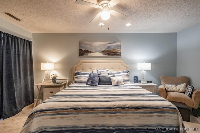 28 Eleven W Ct Unit 2A, Sunrise Beach, MO 65079 - bedroom featuring carpet, a textured ceiling, and a ceiling fan