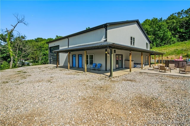 1972 Anderson Hollow Rd, Linn Creek, MO 65052 - back of property with a patio area and an outdoor hangout area