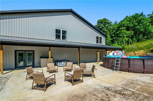 1972 Anderson Hollow Rd, Linn Creek, MO 65052 - back of house featuring french doors, an outdoor living space, a patio area, and an outdoor pool