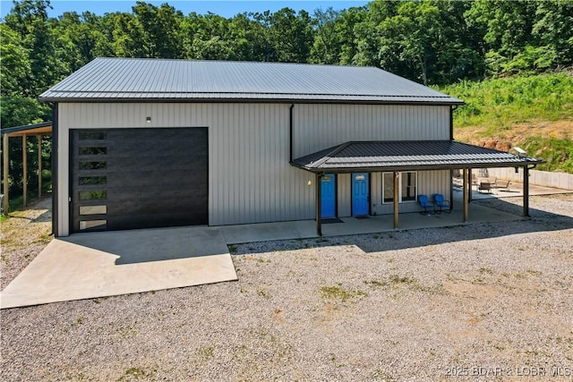 1972 Anderson Hollow Rd, Linn Creek, MO 65052 - view of front of house with covered porch, driveway, and a metal roof