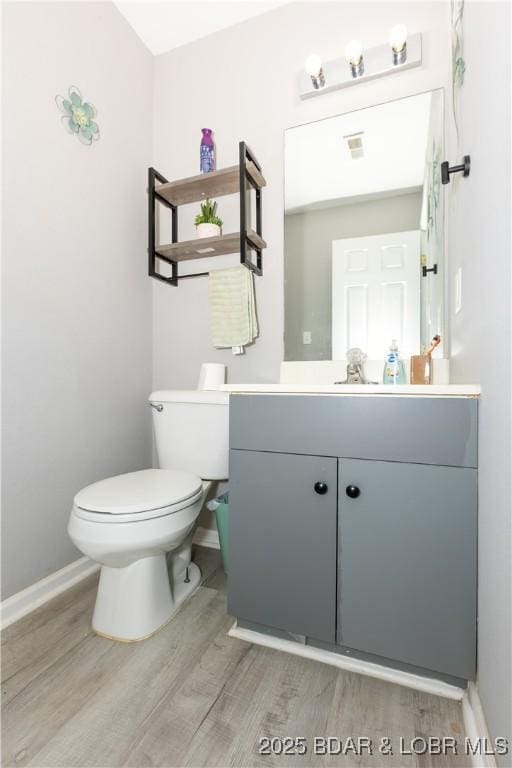 152 Pawnee Rd, Lake Ozark, MO 65049 - bathroom with wood finished floors and vanity
