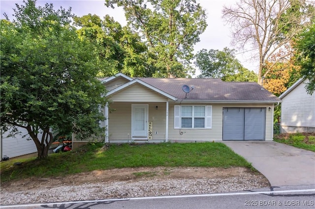 152 Pawnee Rd, Lake Ozark, MO 65049 - view of front of house with concrete driveway, an attached garage, roof with shingles, covered porch, and a front yard