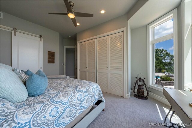 348 Cedar Crest Dr, Lake Ozark, MO 65049 - bedroom featuring a closet, multiple windows, light carpet, recessed lighting, and ceiling fan