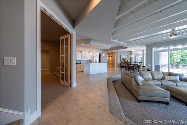 348 Cedar Crest Dr, Lake Ozark, MO 65049 - living area featuring light tile patterned floors, a ceiling fan, and french doors