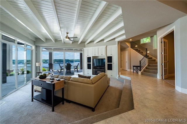 348 Cedar Crest Dr, Lake Ozark, MO 65049 - living room with plenty of natural light, ceiling fan, beamed ceiling, and stairs