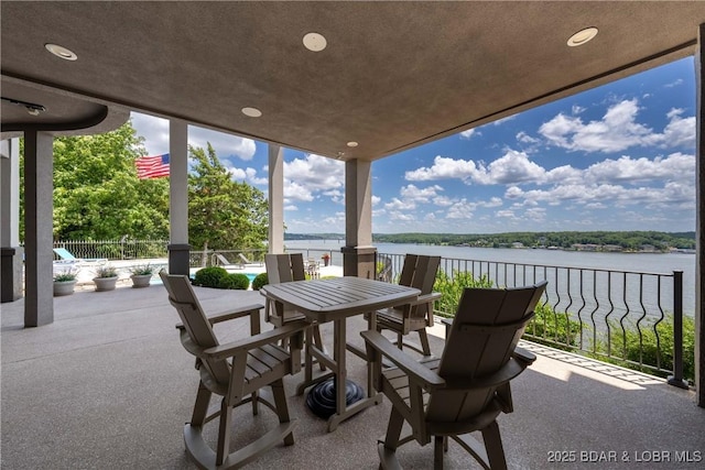 348 Cedar Crest Dr, Lake Ozark, MO 65049 - view of patio / terrace featuring a water view and outdoor dining area