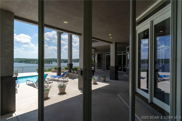 348 Cedar Crest Dr, Lake Ozark, MO 65049 - view of pool with a water view and a patio area