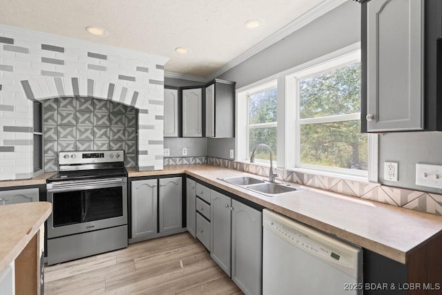 1123 Woodland Dr, Eldon, MO 65026 - kitchen featuring electric stove, white dishwasher, ornamental molding, light countertops, and tasteful backsplash