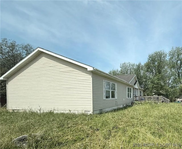 1123 Woodland Dr, Eldon, MO 65026 - view of property exterior featuring crawl space and a deck