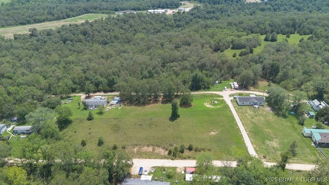 1123 Woodland Dr, Eldon, MO 65026 - aerial overview of property's location featuring a heavily wooded area