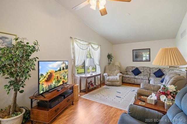 1150 Georgene Rd, Camdenton, MO 65020 - living area featuring vaulted ceiling, wood finished floors, and ceiling fan