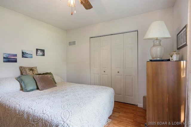 1150 Georgene Rd, Camdenton, MO 65020 - bedroom with light wood-style floors, a closet, and a ceiling fan