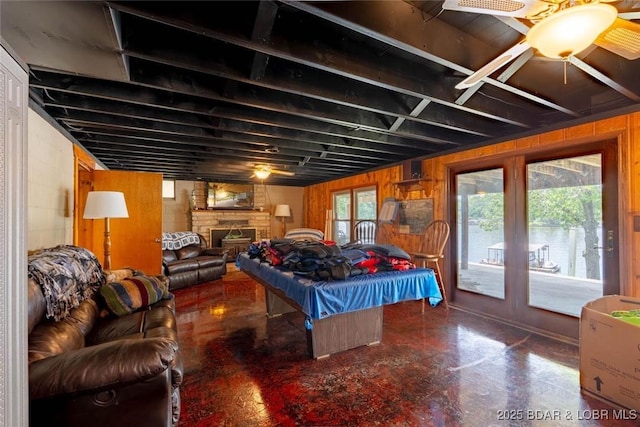 57 Ke Jo Point Rd, Gravois Mills, MO 65037 - bedroom with pool table, access to outside, a fireplace, and wood walls