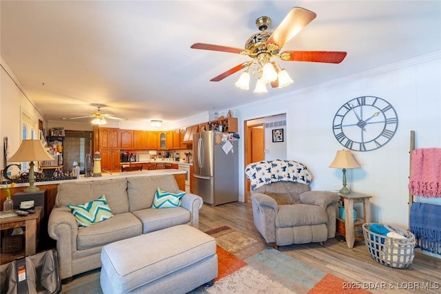 57 Ke Jo Point Rd, Gravois Mills, MO 65037 - living area with a ceiling fan, light wood-style floors, and ornamental molding