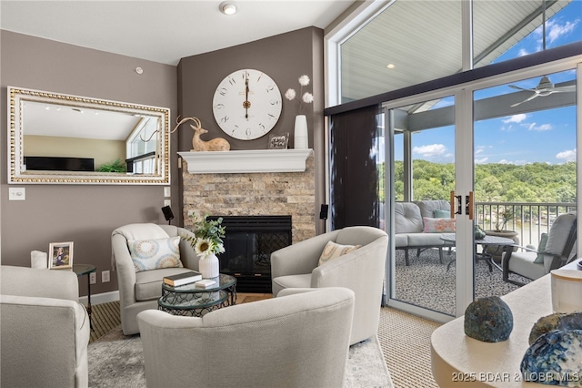 52 Summer Place Ct Unit 4B, Camdenton, MO 65020 - living room featuring a fireplace, ceiling fan, and carpet flooring
