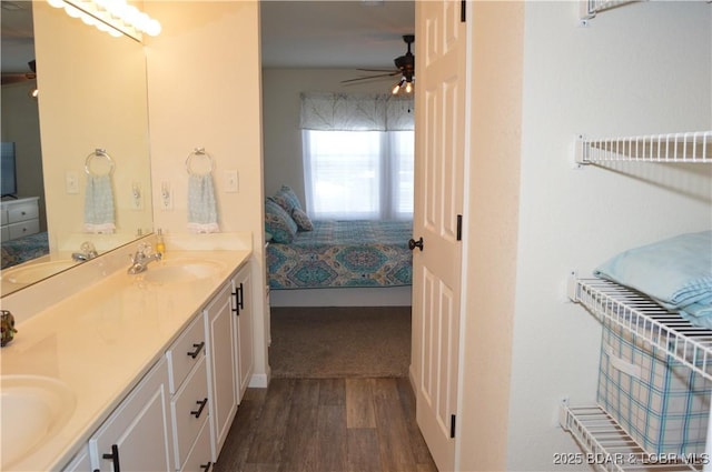 40 Lighthouse Rd Unit 6-201, Lake Ozark, MO 65049 - ensuite bathroom featuring wood finished floors, double vanity, and a ceiling fan