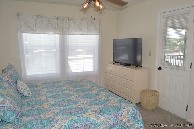 40 Lighthouse Rd Unit 6-201, Lake Ozark, MO 65049 - carpeted bedroom featuring multiple windows and a ceiling fan