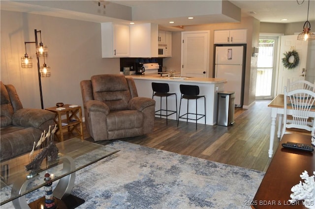 40 Lighthouse Rd Unit 6-201, Lake Ozark, MO 65049 - living area with dark wood finished floors and recessed lighting