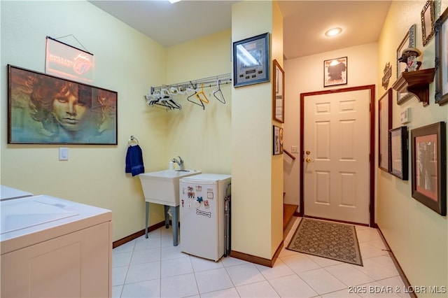 67 Windjammer Estates Dr, Lake Ozark, MO 65049 - washroom featuring separate washer and dryer and light tile patterned flooring