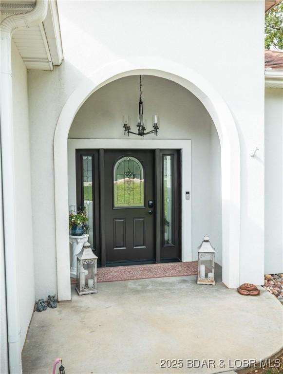 432 Cornett Branch Rd, Four Seasons, MO 65049 - view of exterior entry with stucco siding
