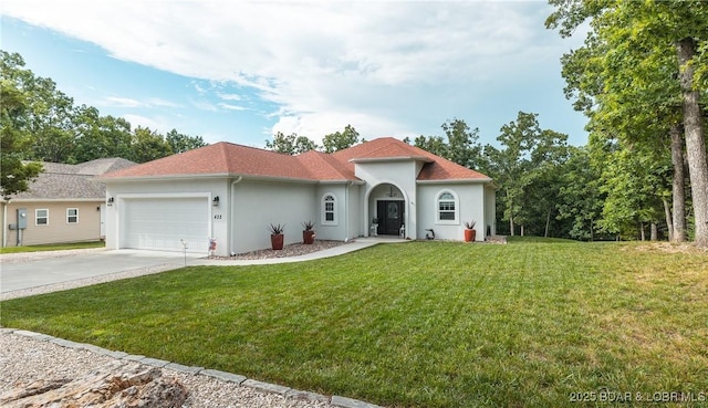432 Cornett Branch Rd, Four Seasons, MO 65049 - mediterranean / spanish-style house with an attached garage, stucco siding, driveway, and a front lawn