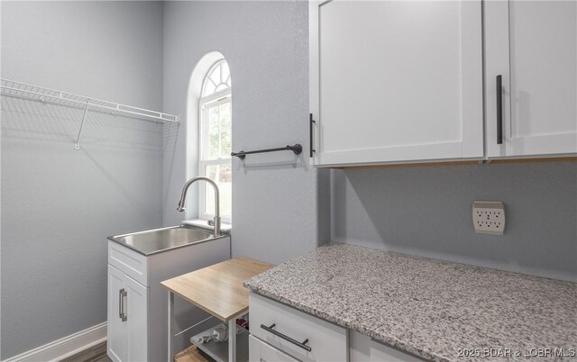 432 Cornett Branch Rd, Four Seasons, MO 65049 - laundry room featuring a sink