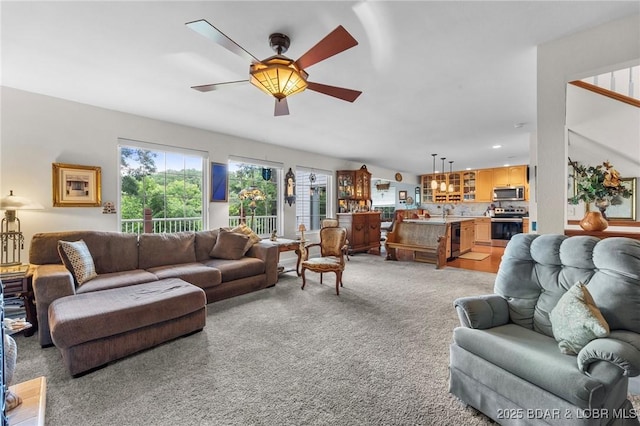 1008 Beacon Ridge Dr, Lake Ozark, MO 65049 - living area featuring ceiling fan, light colored carpet, and recessed lighting