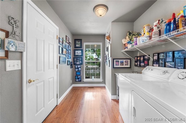 1008 Beacon Ridge Dr, Lake Ozark, MO 65049 - washroom with light wood finished floors and separate washer and dryer