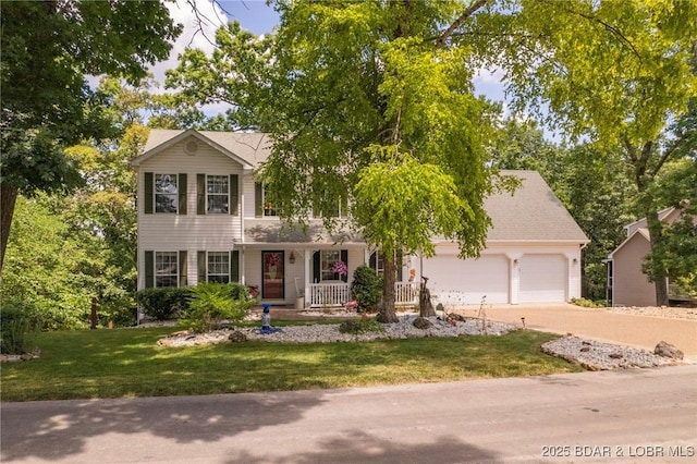 1008 Beacon Ridge Dr, Lake Ozark, MO 65049 - view of front facade with a porch, an attached garage, driveway, and a front lawn