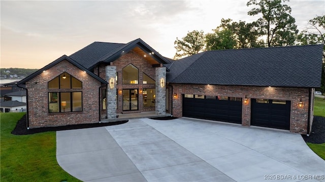 1254 Darwin Dr, Osage Beach, MO 65065 - view of front of home with brick siding, driveway, a garage, and a front lawn