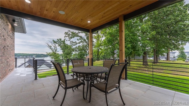 1254 Darwin Dr, Osage Beach, MO 65065 - view of patio with a water view and outdoor dining area