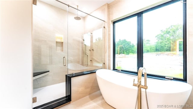 1254 Darwin Dr, Osage Beach, MO 65065 - bathroom with a stall shower and a freestanding tub