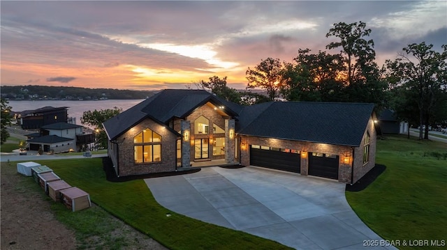 1254 Darwin Dr, Osage Beach, MO 65065 - view of front facade with stone siding, concrete driveway, an attached garage, and a front lawn
