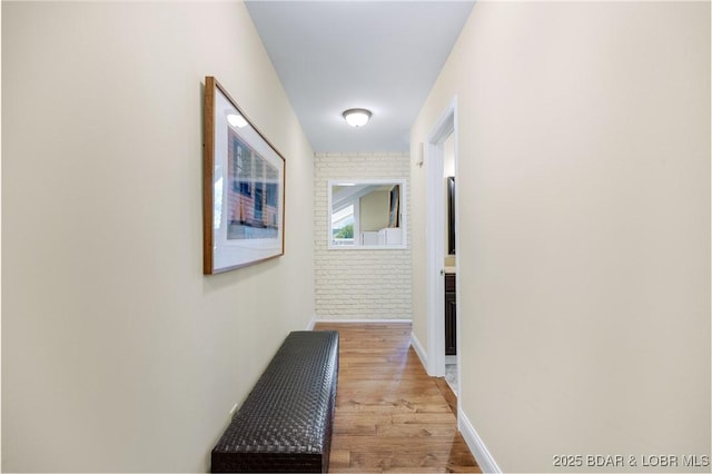 541 Elbow Cay Dr, Osage Beach, MO 65065 - hallway featuring light wood-style floors and brick wall