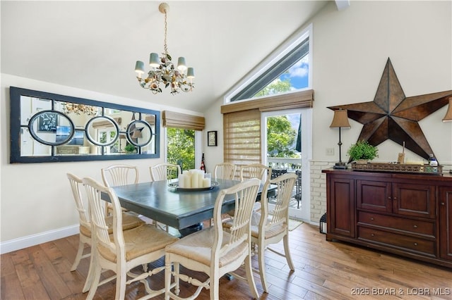 541 Elbow Cay Dr, Osage Beach, MO 65065 - dining area with a chandelier, light wood-type flooring, and high vaulted ceiling