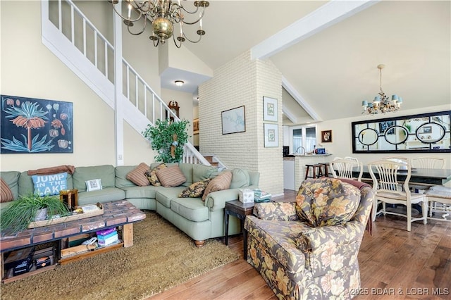 541 Elbow Cay Dr, Osage Beach, MO 65065 - living area featuring a chandelier, stairs, hardwood / wood-style floors, beam ceiling, and high vaulted ceiling