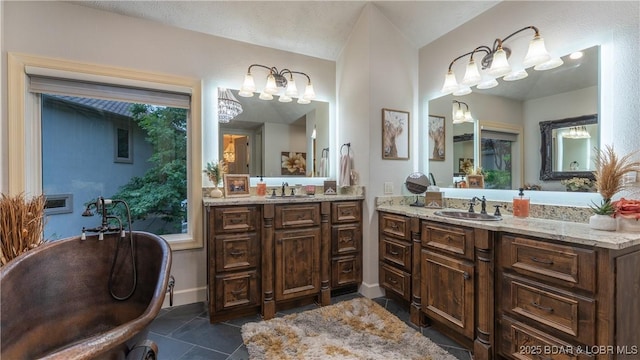 1453 Grand View Dr, Porto Cima, MO 65079 - full bath featuring two vanities, a freestanding bath, tile patterned flooring, and a chandelier